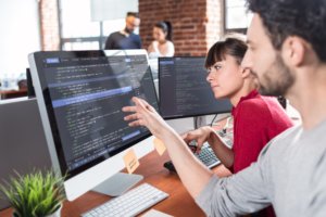 programmers looking at screen